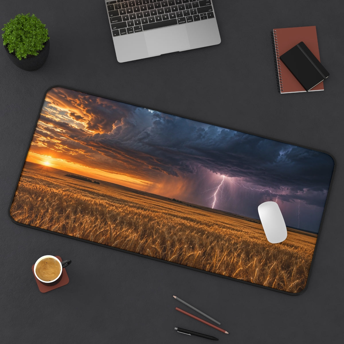 Prairie Storm desk mat on a desk with a laptop, mouse and coffee cup for scale
