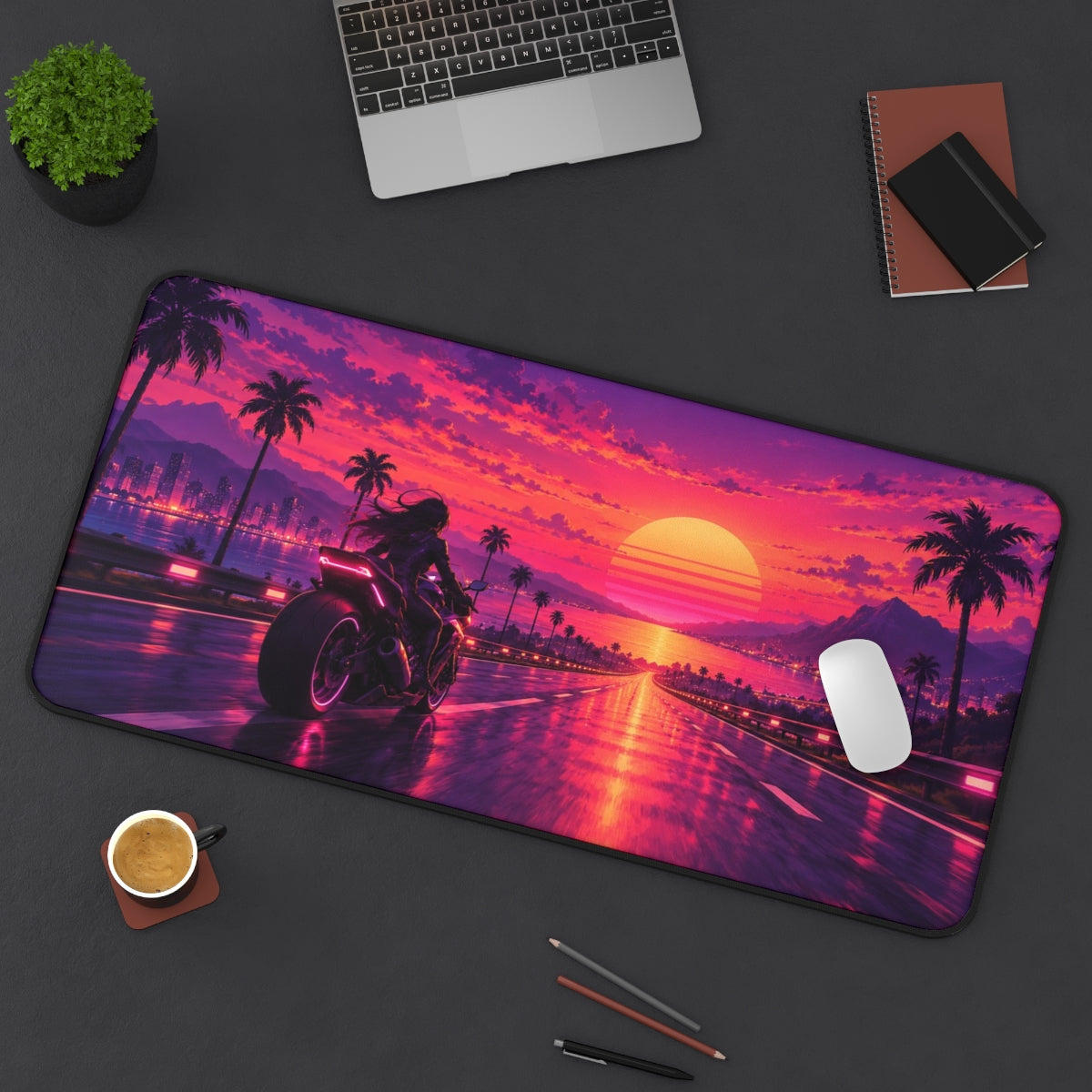 Synthwave Highway desk mat on a desk with a laptop, mouse and coffee cup for scale