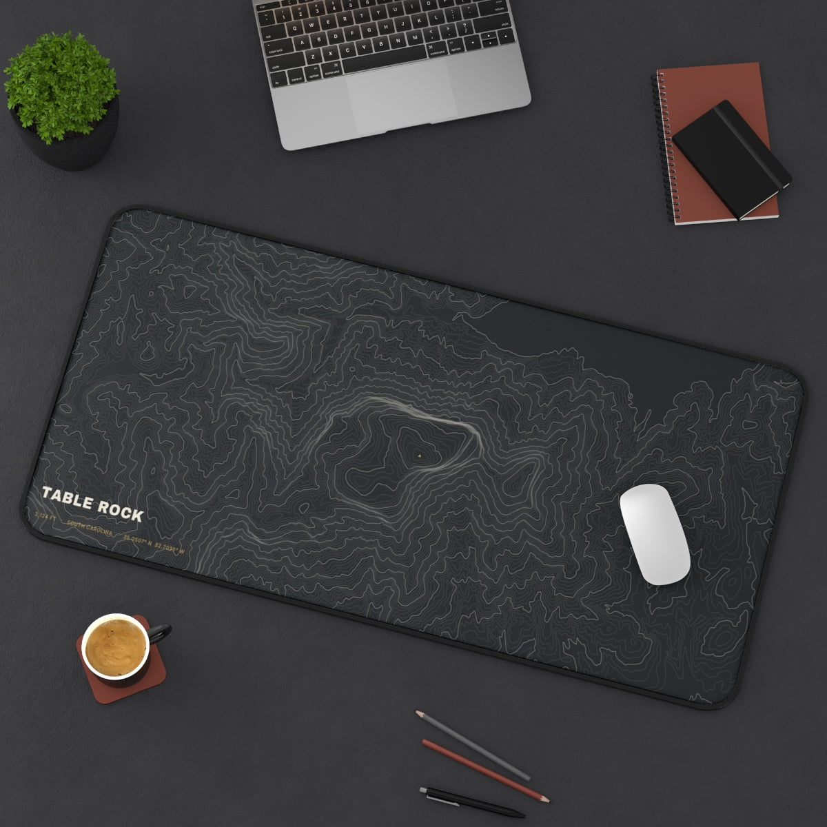 Table Rock Topo desk mat on a desk with a laptop, mouse and coffee cup for scale