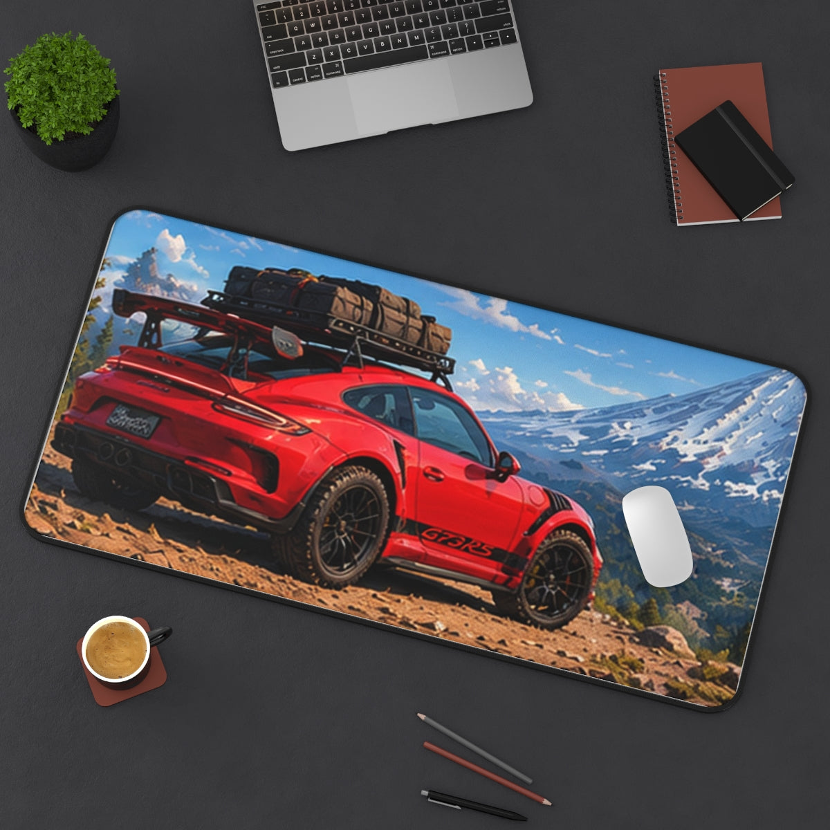 Red Overland desk mat on a desk with a laptop, mouse and coffee cup for scale