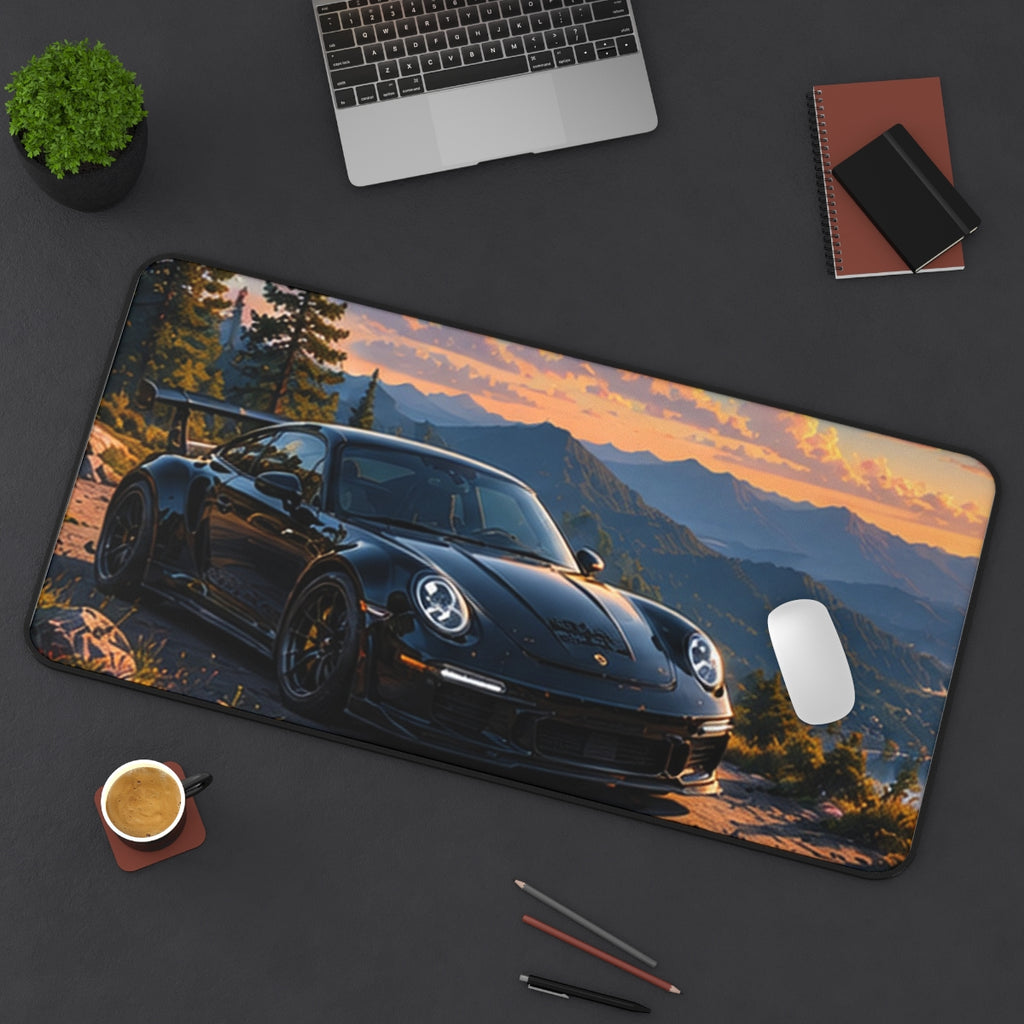 Sunset Mountain desk mat on a desk with a laptop, mouse and coffee cup for scale